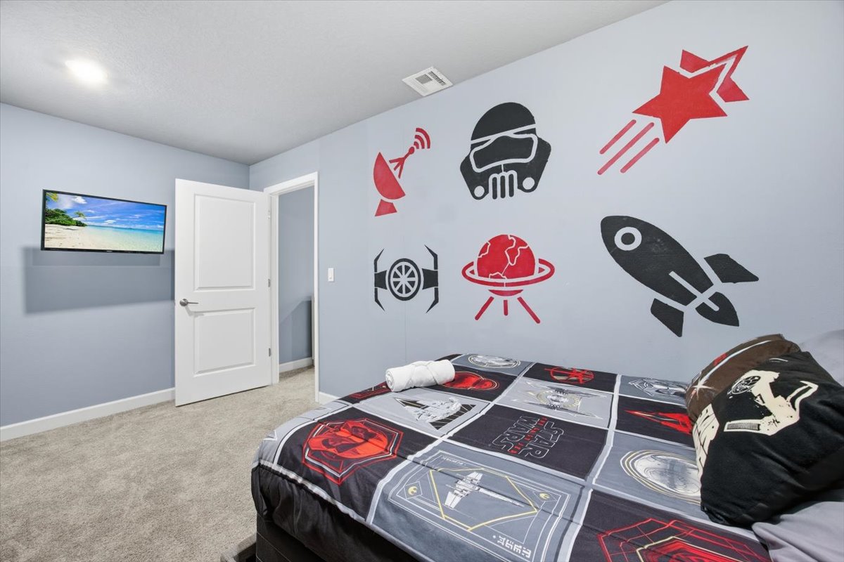 Star Wars themed bedroom with wall art