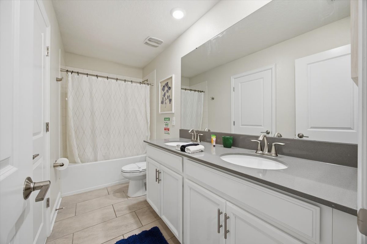 Shared bathroom with double vanity
