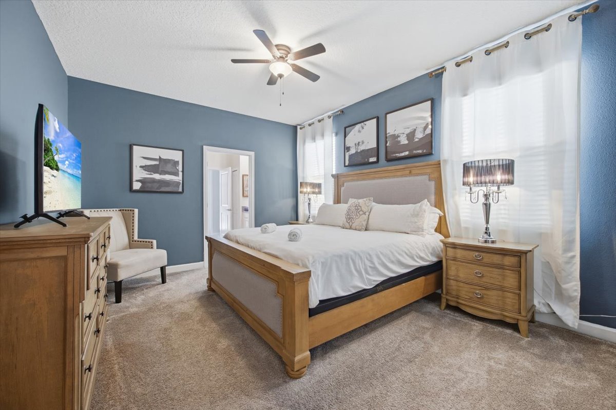King bedroom with blue accent wall
