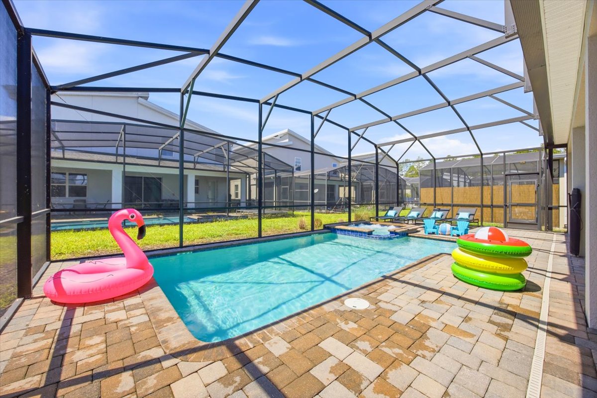 Screened pool with flamingo float